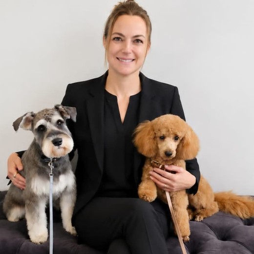 Fiona, master groomer and founder of K9Stylez, with two of her dogs